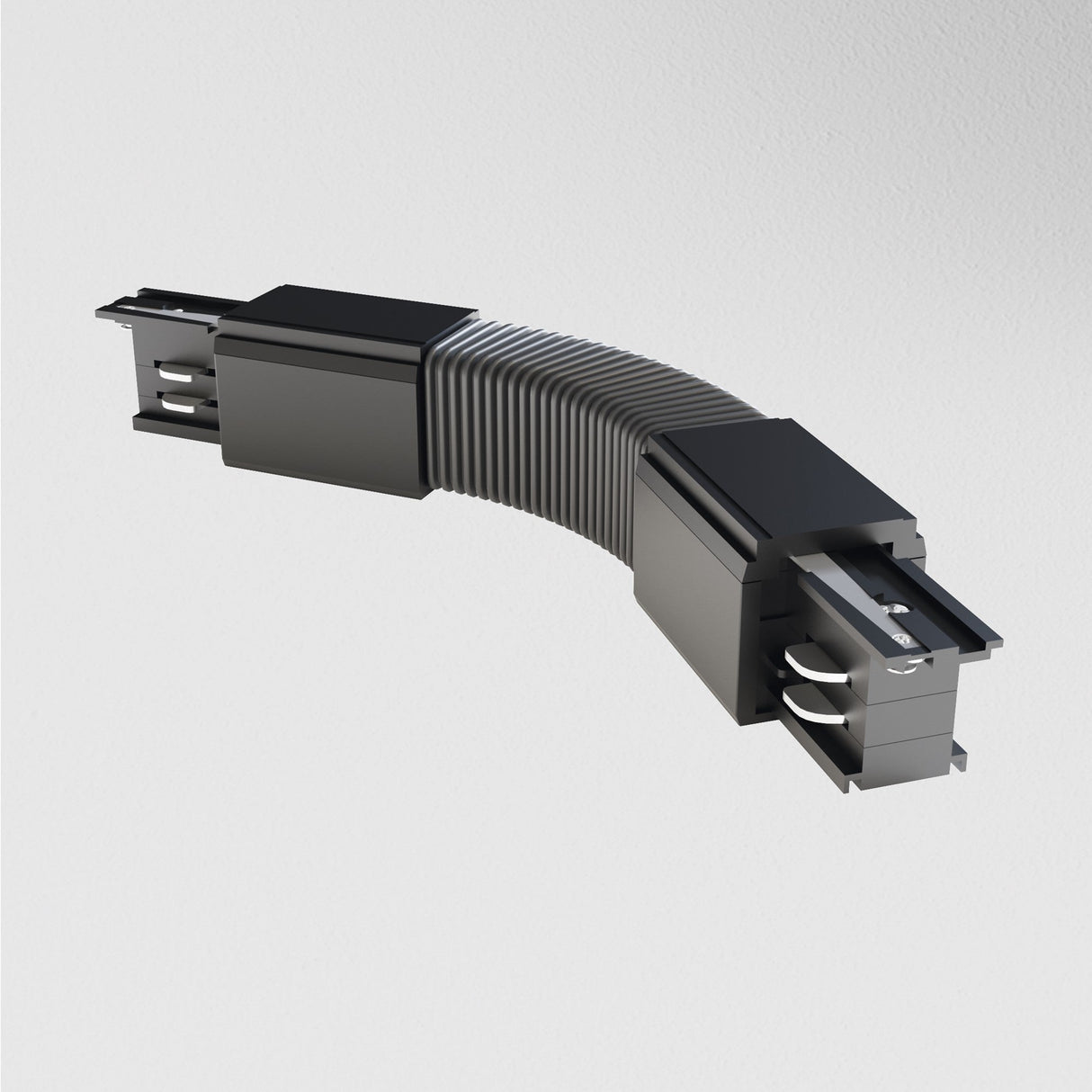 The black 3-Phase Surface-Mounted Track Trinity Flexible Connector, with its ribbed joint, is perfect for modern interiors. It enhances three-phase track lighting and stands out against white backgrounds.