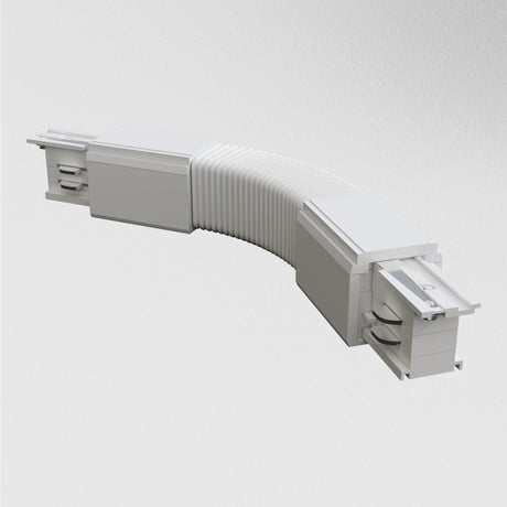 The 3-Phase Surface-Mounted Track Trinity Flexible Connector in white is a curved, flexible connector with flat ends and a ribbed center. Its designed for linking components in three-phase track lighting systems and features sliding mechanisms with socket-like termini.
