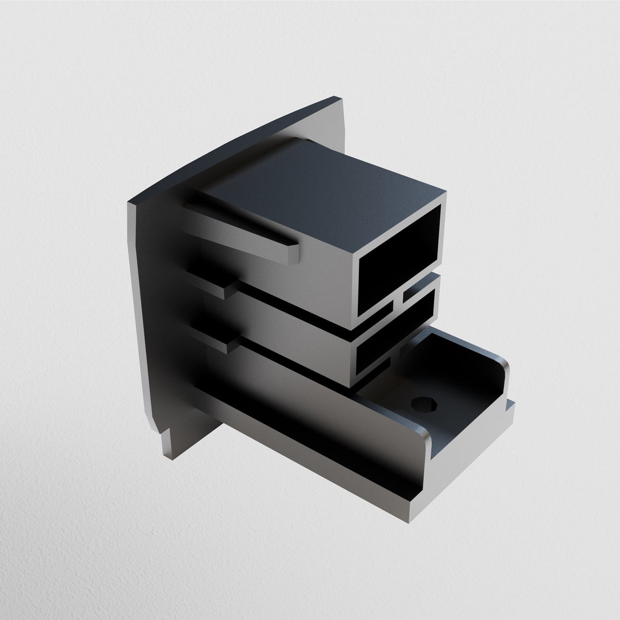 A 3D rendering of the Trinity End Cap for a 3-Phase Surface-Mounted Track showcases its metallic, angular design and rectangular hollow structure. The plain white background accentuates this industrial components versatility in modern track lighting systems.