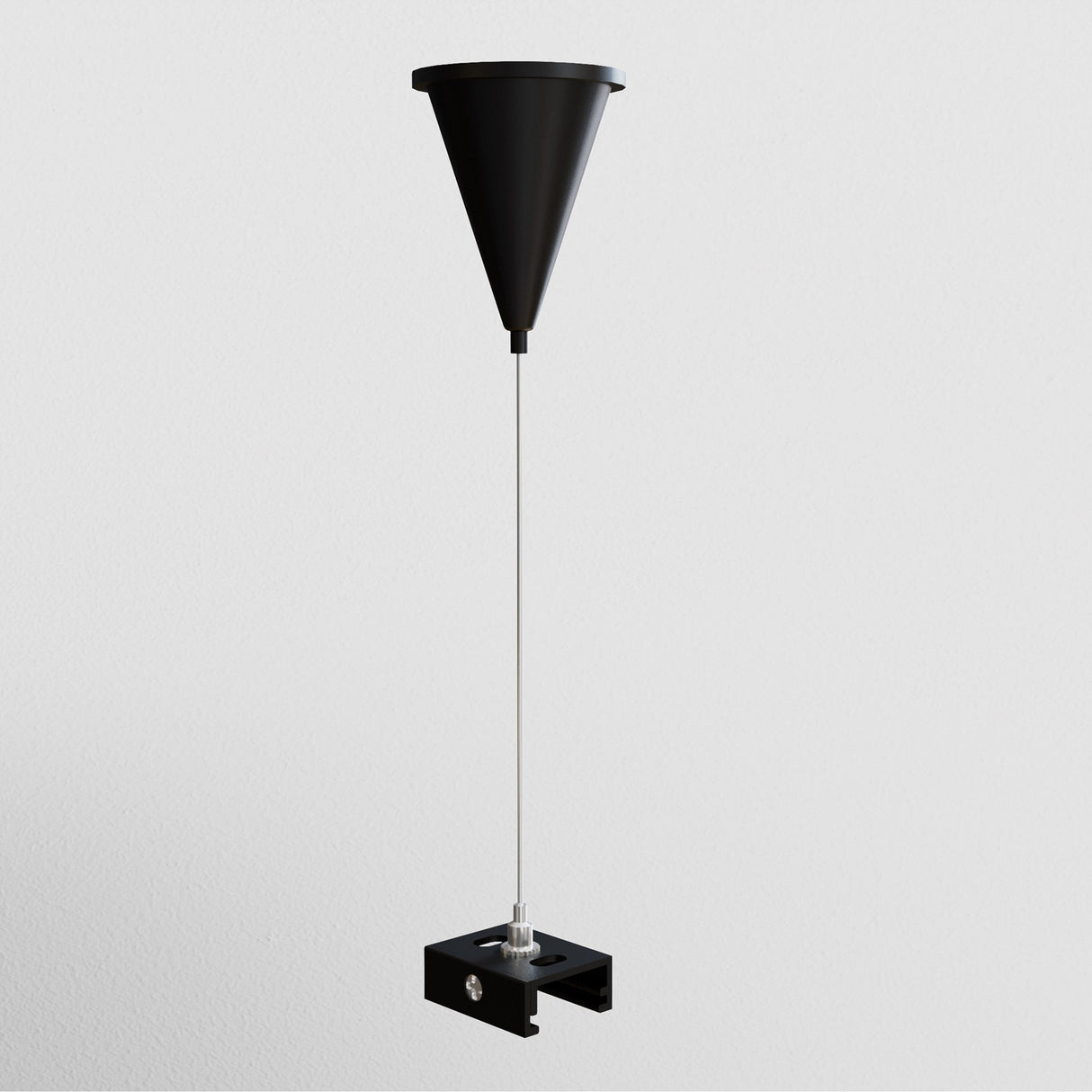 The 3-Phase Surface-Mounted Track Trinity Suspension Cable - Black is mounted on a light gray wall, featuring a funnel-shaped design with a sleek black finish, thin rod, and rectangular base. It also includes a long, adjustable cable to add elegance to any room.