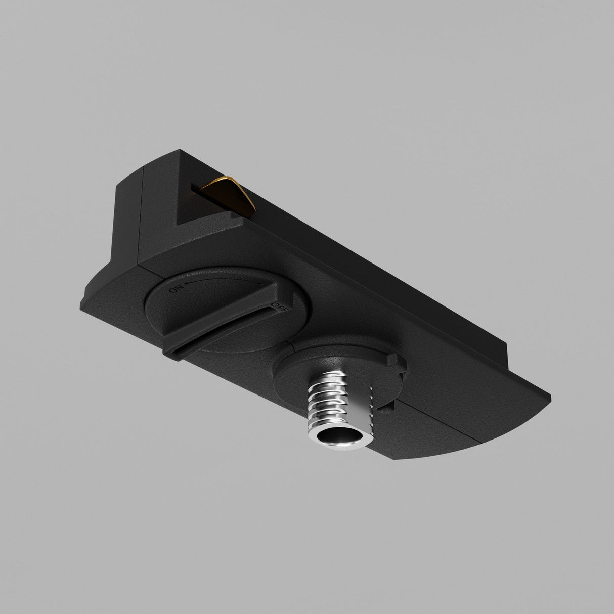 Close-up of a Unity Single Phase Track Connector in black, featuring a cable connector and two dials on its underside, resembling a track connector, isolated against a gray background.