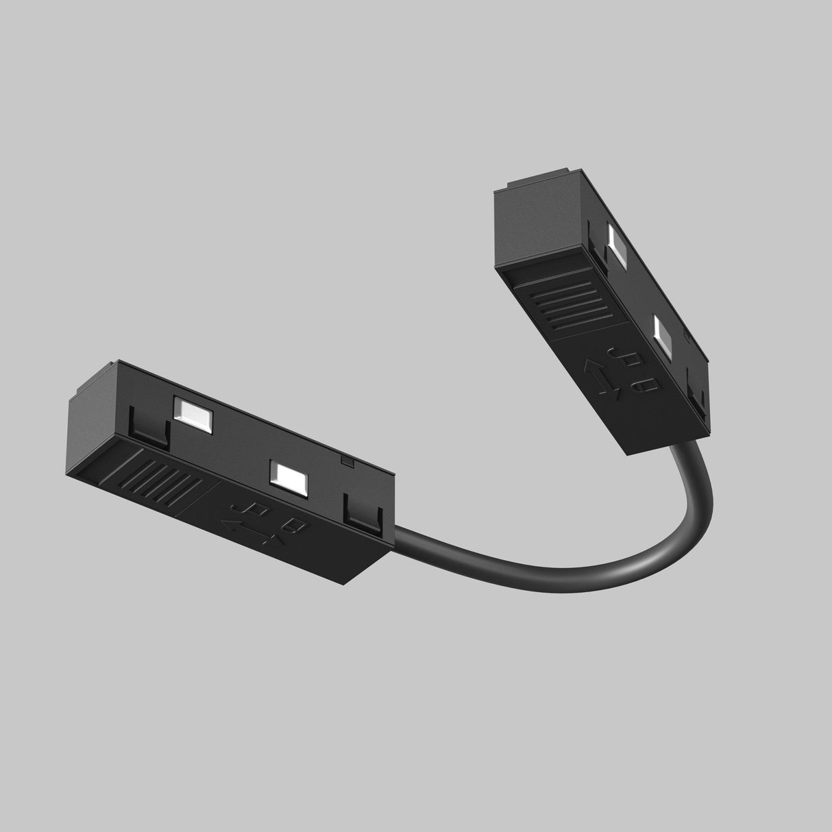 Exility Track Flexible Corner Power Connector 15cm - Black: Sleek black rectangular electronic connectors linked by a flexible corner connector against a gray background; each features pins and slots for easy port fitting.