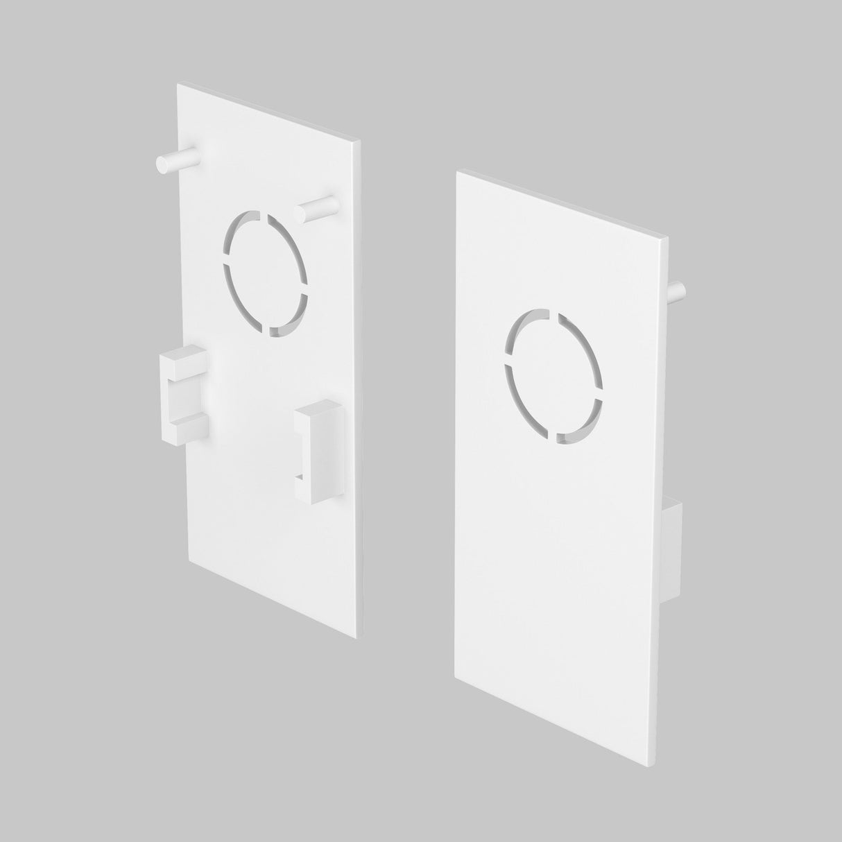 Two white rectangular end caps with circular cutouts and tabs, designed for the Exility Magnetic Surface-Mounted Track lighting system, are displayed from various angles against a gray background.