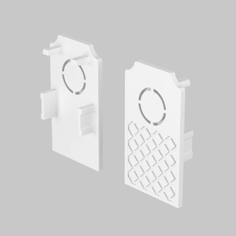 Two white, rectangular panels on a gray background resemble Exility End Cap 2-Pack for Built-in Tracks. Each has a circular cutout at the top and side tabs, with one panel showcasing a lattice design on its lower half.