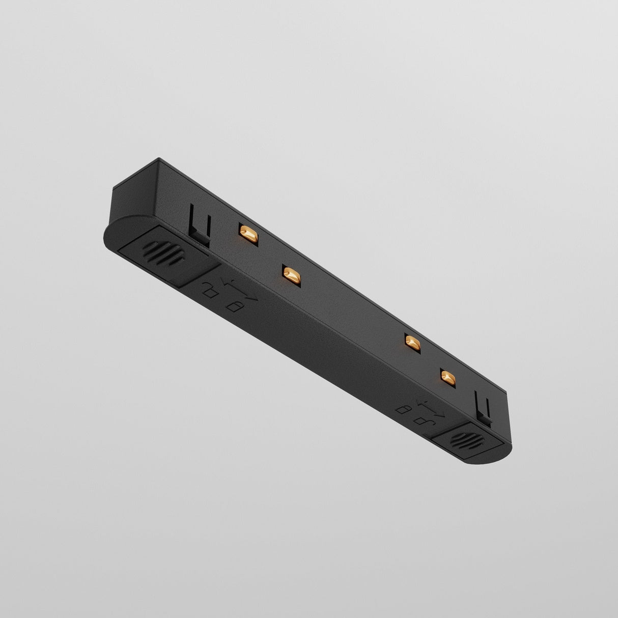 The Exility Track Straight Power Connector - Black is a sleek electronic device in rectangular form, featuring three small orange indicator lights and side symbols with power connectors, set against a plain light gray background, ideal for track lighting.