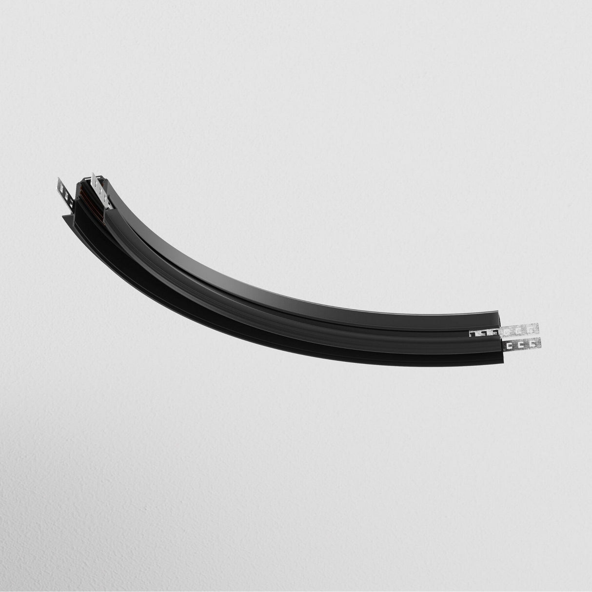 The Exility Tracks Radius Connector R300, a black, curved semi-cylindrical design for 9.5mm plasterboard, is displayed on a plain white background. It casts a soft shadow, evoking modern recessed track lighting aesthetics.