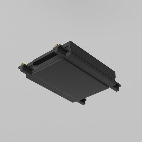 The Radity Magnetic Track Straight Power Connector - Black is sleek and rectangular with a minimalist design featuring gold connectors at its corners. Set against a plain gray background, it exudes a modern and industrial vibe.