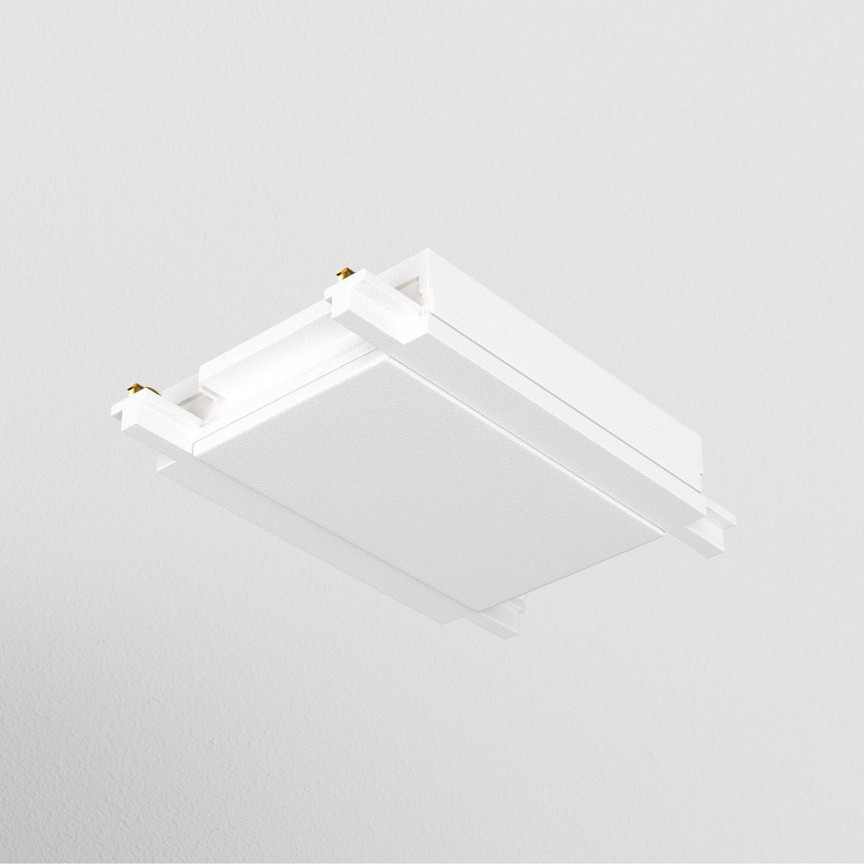 The modern, white ceiling light fixture, featuring a Radity Magnetic Track Straight Power Connector, is mounted on a smooth ceiling. Its minimalist design showcases clean lines and a slightly recessed center panel for versatile lighting configurations.