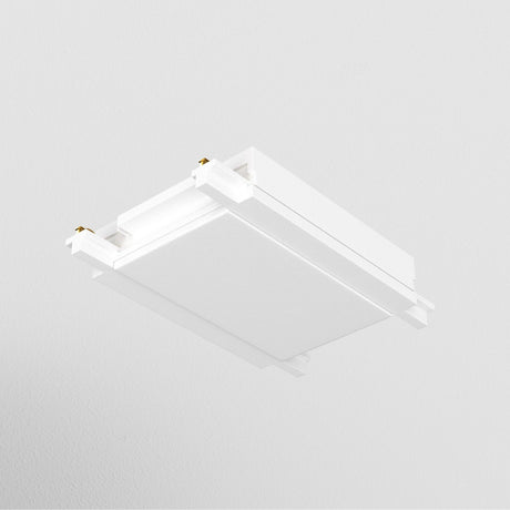 The modern, white ceiling light fixture, featuring a Radity Magnetic Track Straight Power Connector, is mounted on a smooth ceiling. Its minimalist design showcases clean lines and a slightly recessed center panel for versatile lighting configurations.