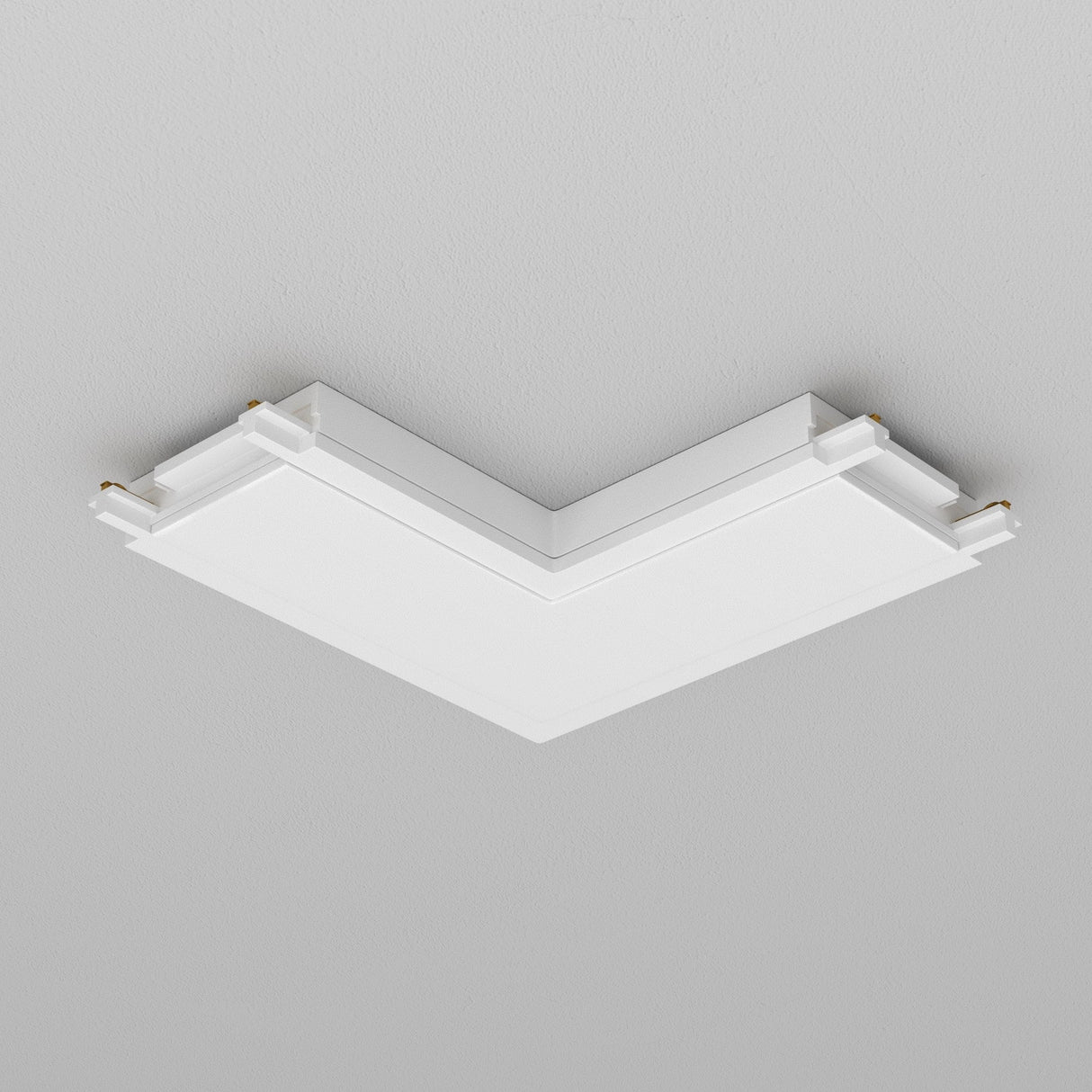 Mounted on a smooth, light gray ceiling, this minimalist white V-shaped ceiling light fixture utilizes Radity Magnetic Track L-Shaped Power Connector - White for parallel layers and clean lines, offering sleek modern geometric appeal.