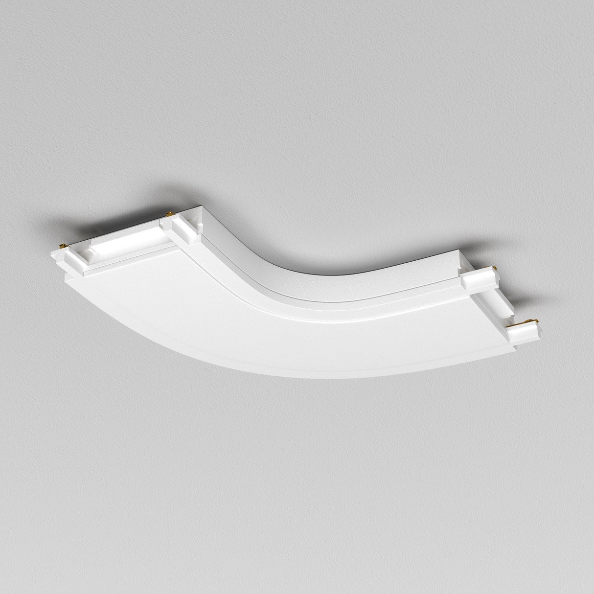 A white curved ceiling panel with a minimalist design seamlessly integrates the Radity Magnetic Track Curved Power Connector against a light gray background. Its smooth material and clean lines enhance the sleek aesthetic.