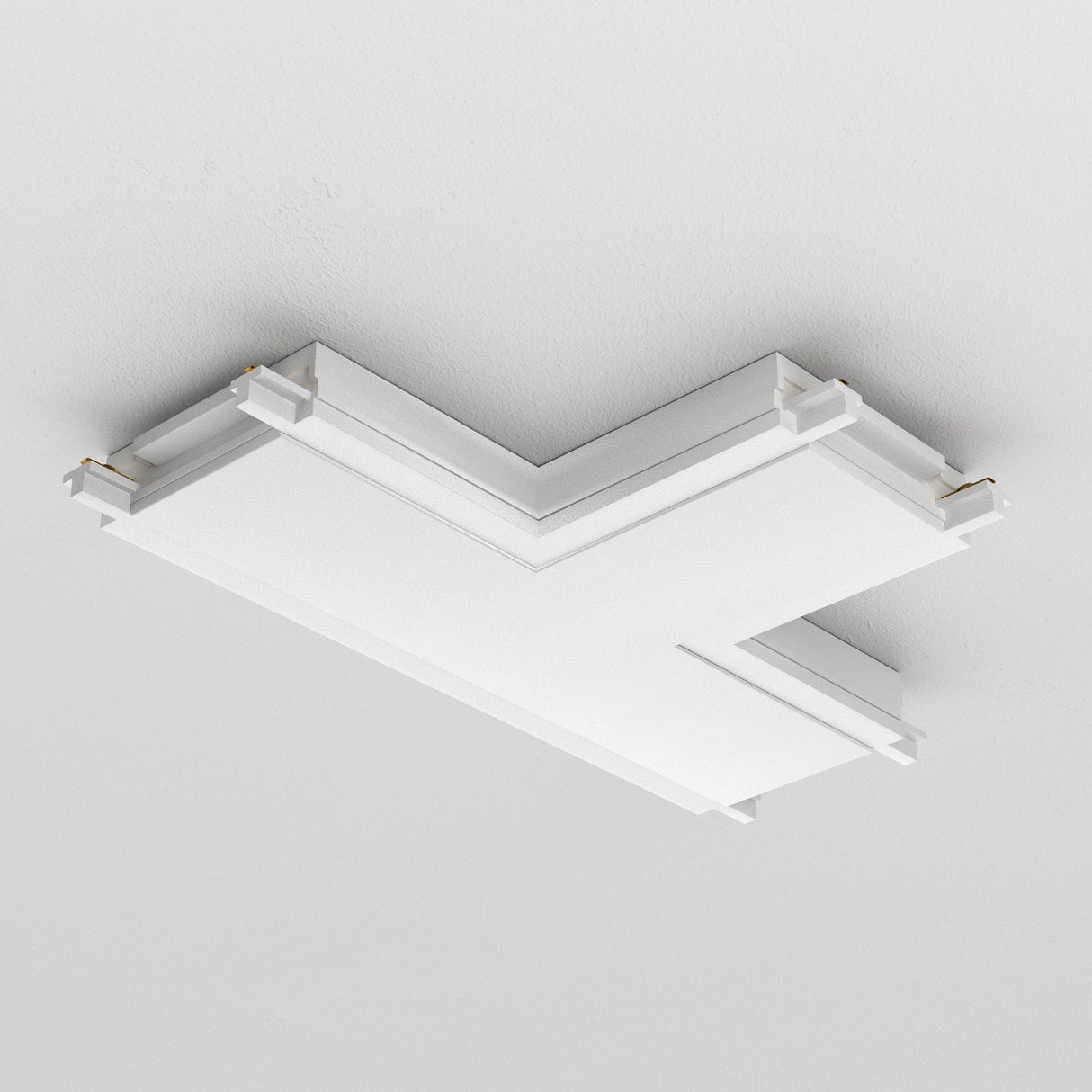 The Radity Magnetic Track T-Shaped Power Connector in white boasts a modern, angular design with layered panels and gold corner accents. Its minimalist look complements sleek interiors and fits perfectly against a plain white ceiling.