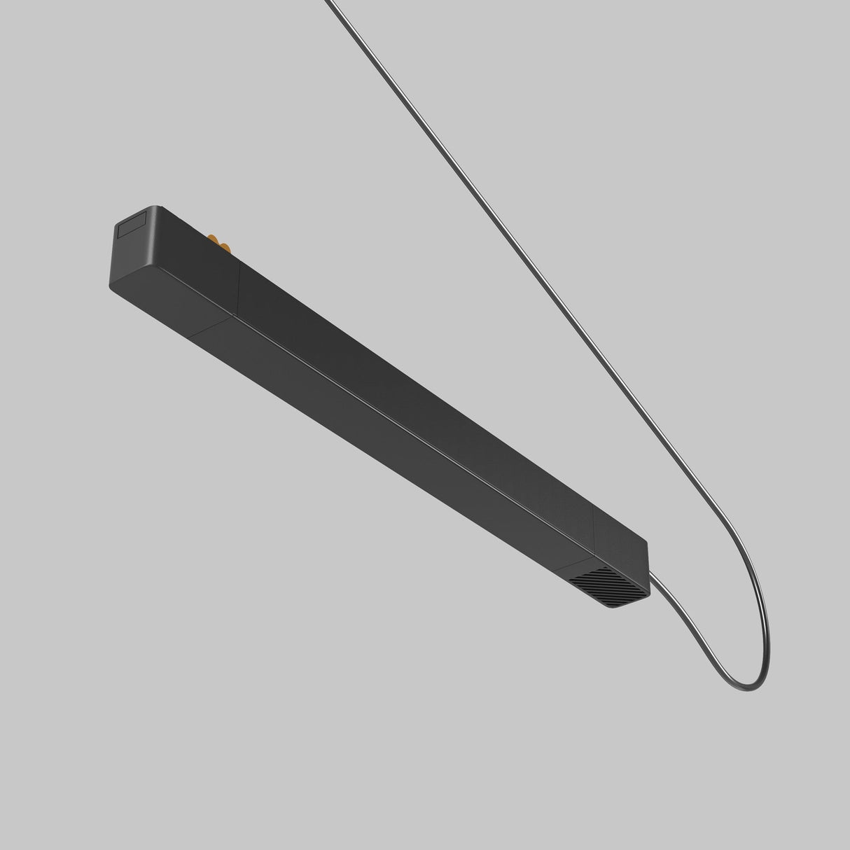 A black Radity Track Power Supply 100W pendant light, featuring a sleek rectangular design and thin power cable elegantly curving upwards against a light gray background, showcases minimalist aesthetics with subtle detailing for an elegant touch.