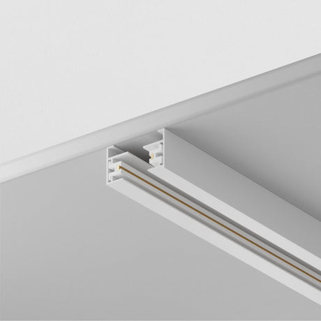 Detailed view of the Unity Single Phase Surface-Mounted Track 1m in white, installed on a white ceiling. Its minimalist design supports adjustable fixtures and seamlessly blends with the ceiling for a modern, streamlined look.