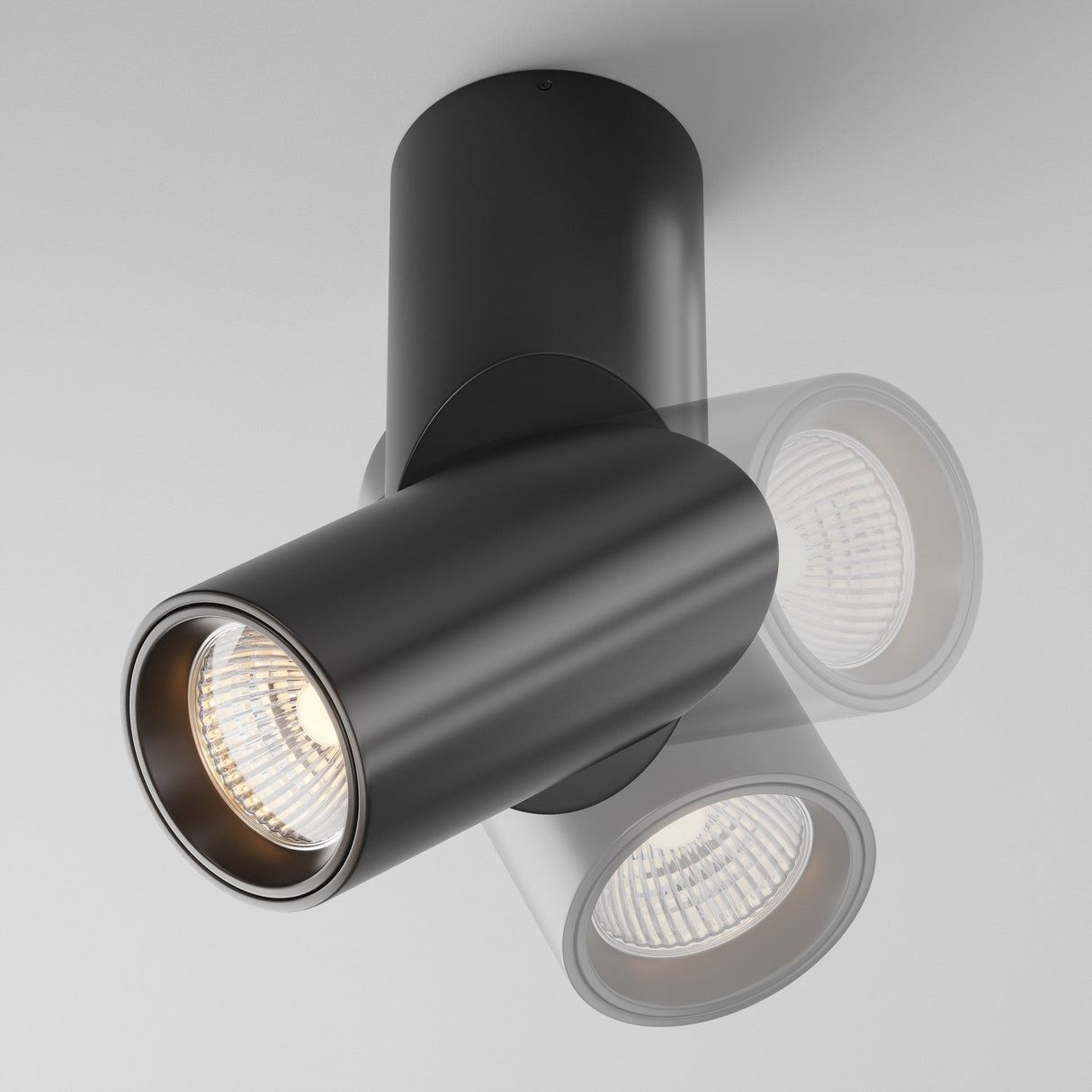 The Dafne LED Single Spotlight 10W 3000K in black offers a modern lighting solution with two adjustable LED spotlights. These cylindrical fixtures are designed for energy efficiency, angled oppositely on white ceilings for soft illumination throughout the space.