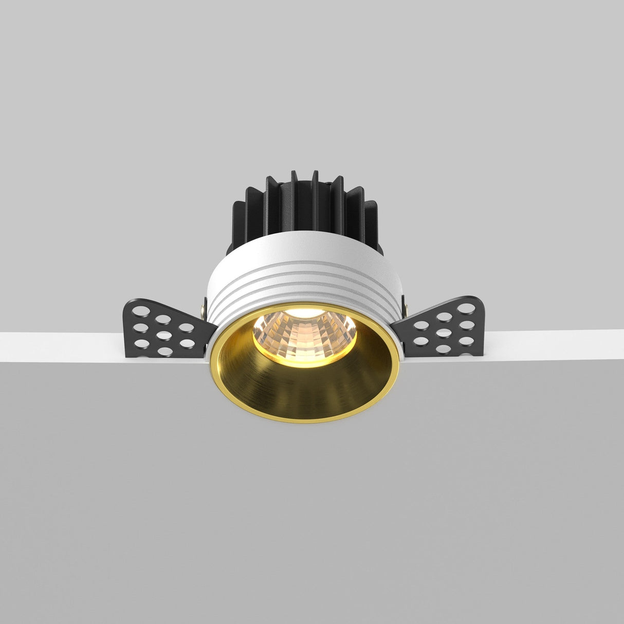 Control and mobility features of round LED recessed trimless downlight in brass, offering versatile lighting adjustments.