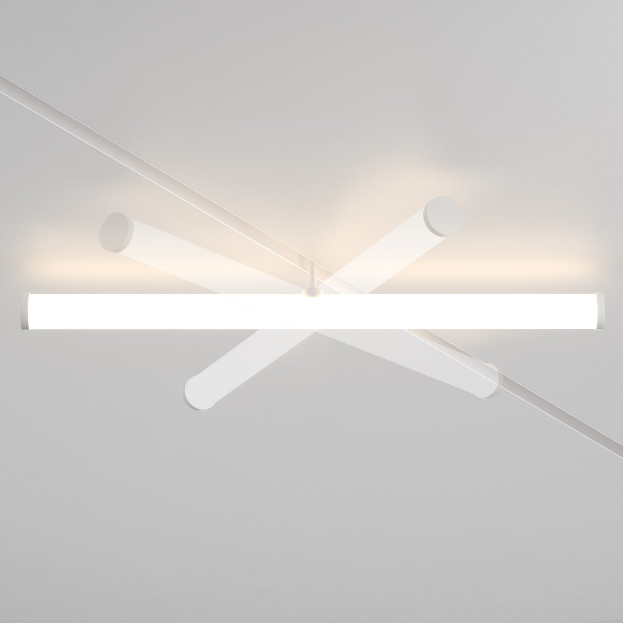 The Larc LED Rotating Linear Track Light for Magnetic Exility 25W 3000K - White features intersecting cylindrical rods with a central glowing rod powered by energy-efficient LEDs, casting angled shadows for a modern geometric design. The white rods are evenly spaced for an elegant finish.