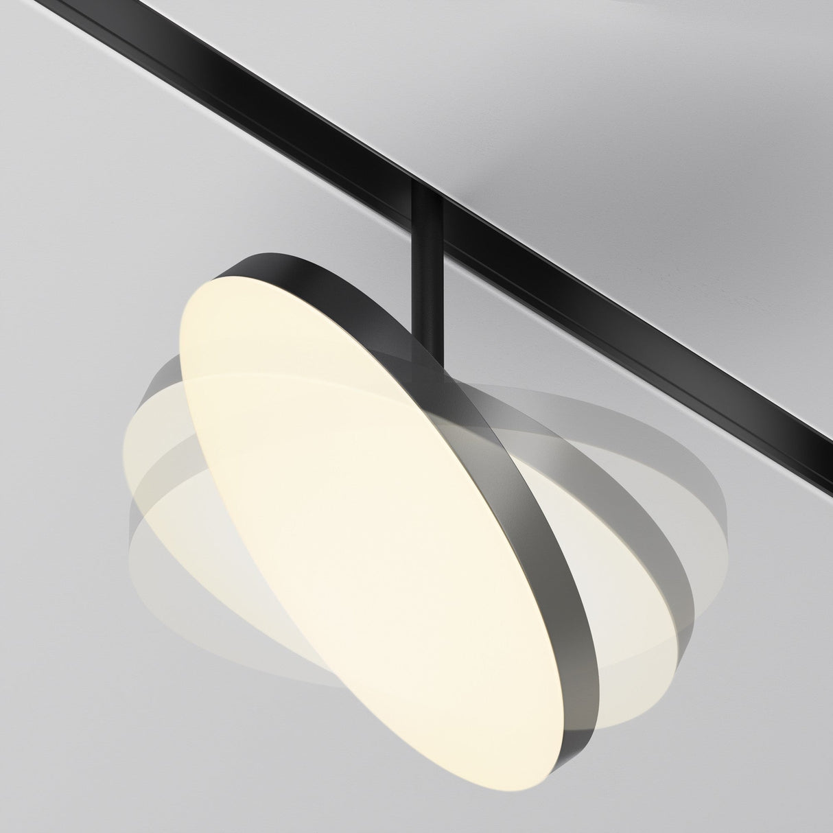 Plato LED Circular spotlight in Black for magnetic Exility track, featuring mobility for dynamic lighting control.