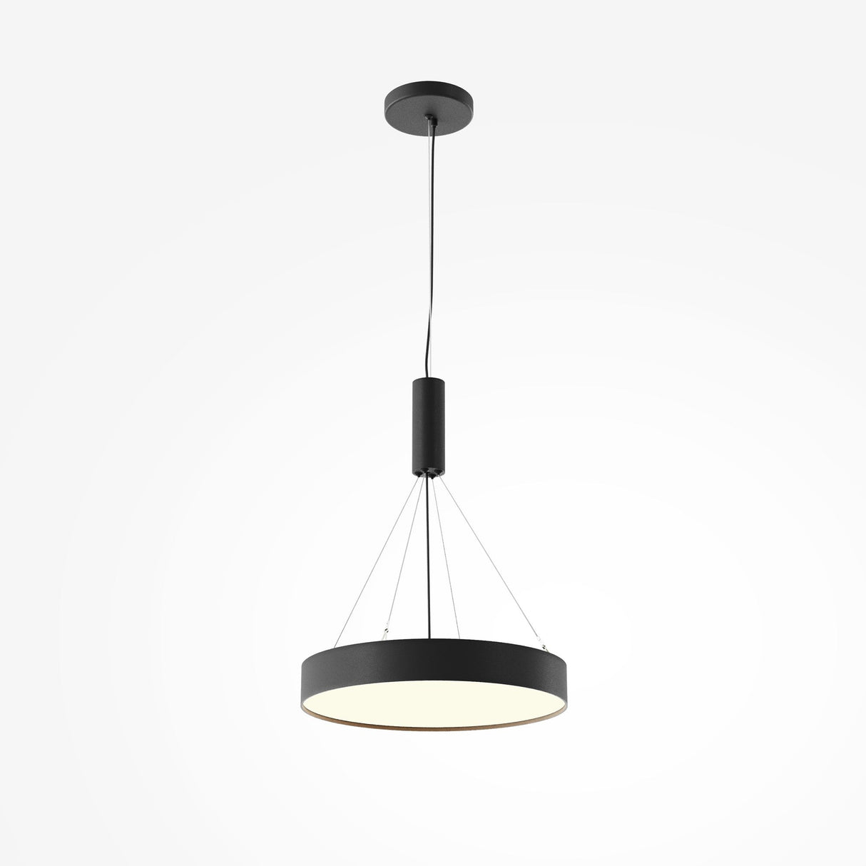 The Zon LED Medium Flush Ceiling Light 3000K 45W - Black hangs elegantly in a modern matte black, featuring a circular flat design suspended by four cables. Its inner surface emits a soft white glow, beautifully contrasting with the sleek black exterior.