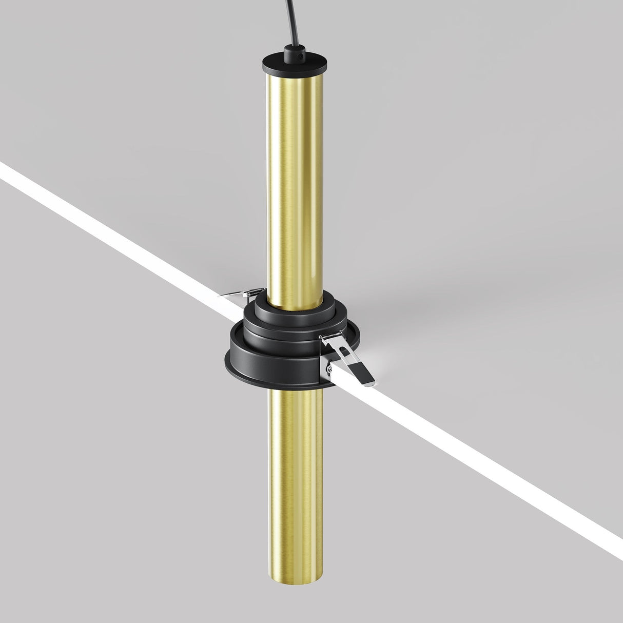 The Focus T LED Downlight, featuring a black and brass finish, elegantly suspends a gold cylindrical rod within a gray surface cut-out, with an adjustable retractable design and two metallic brackets securing it to the top cable.