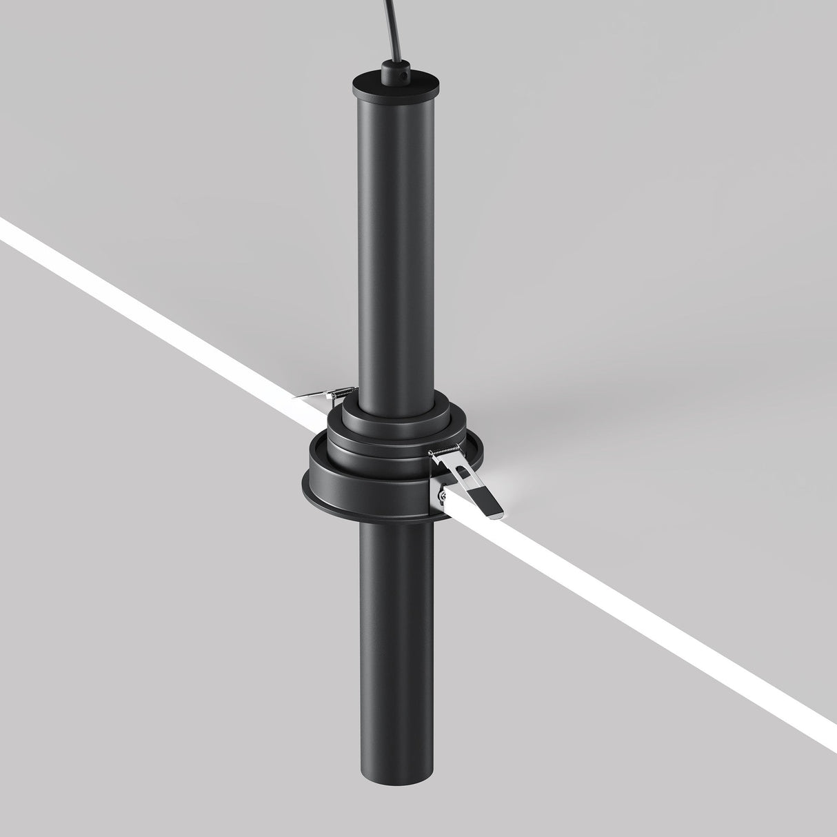 A black Focus T LED Adjustable Long Retractable In-Out Recessed Downlight 7W 3000K is vertically mounted at the corner of a white and gray surface. It features a cable on top, secured with metal brackets, and boasts a minimalistic industrial design.