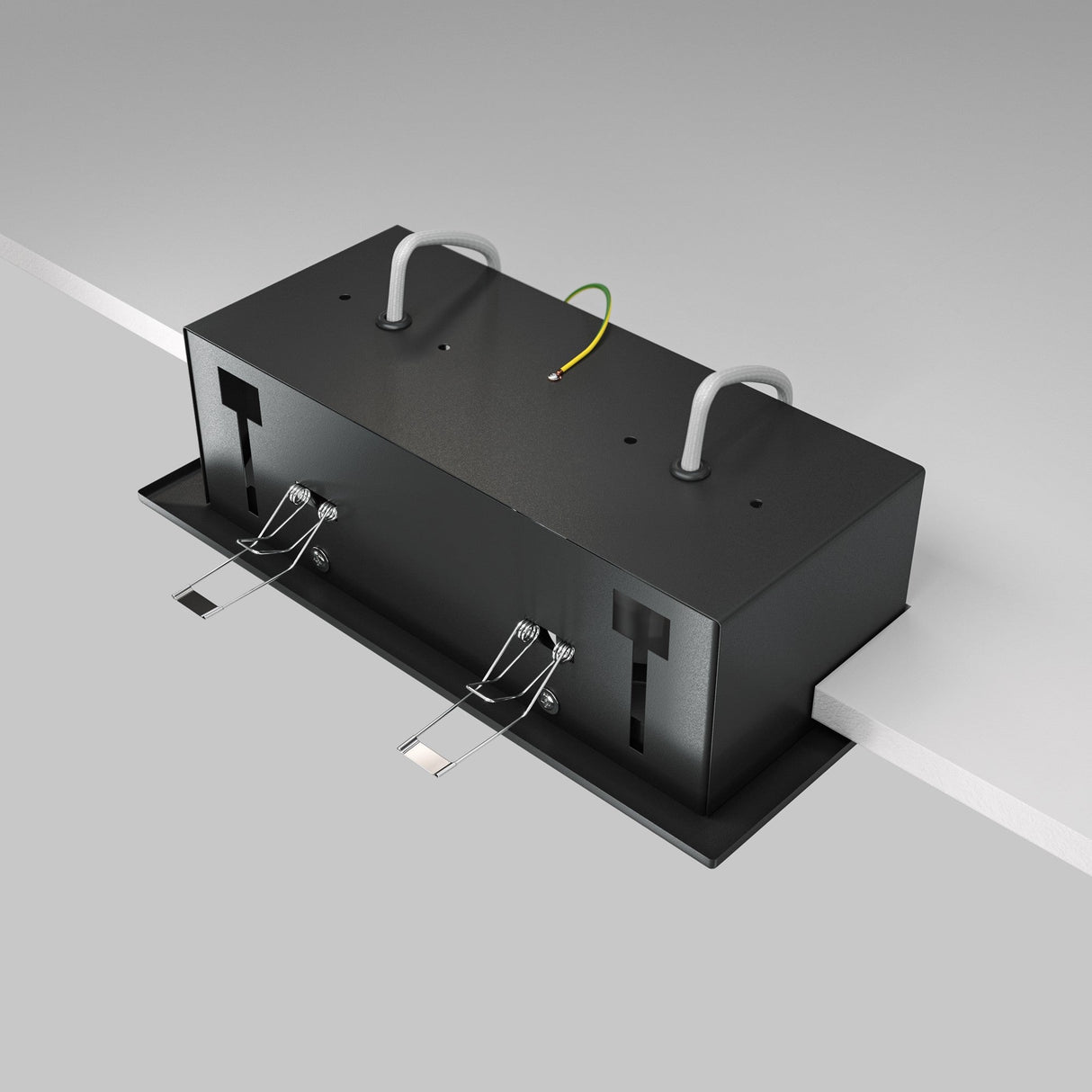 A rectangular black box with two flexible metallic straps and three centered coiled wires, resembling the Metal Modern Twin Tilt Rectangular Recessed Downlight - Black, is mounted on a flat white surface to provide an adjustable light source for sophisticated lighting solutions.