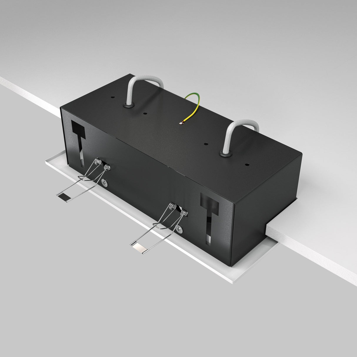 A sleek Metal Modern Twin Tilt Rectangular Recessed Downlight in black is attached beneath a light gray surface. It resembles a modern twin downlight with two protruding cords and a yellow wire, secured by silver clasps at the bottom against a plain gray backdrop.