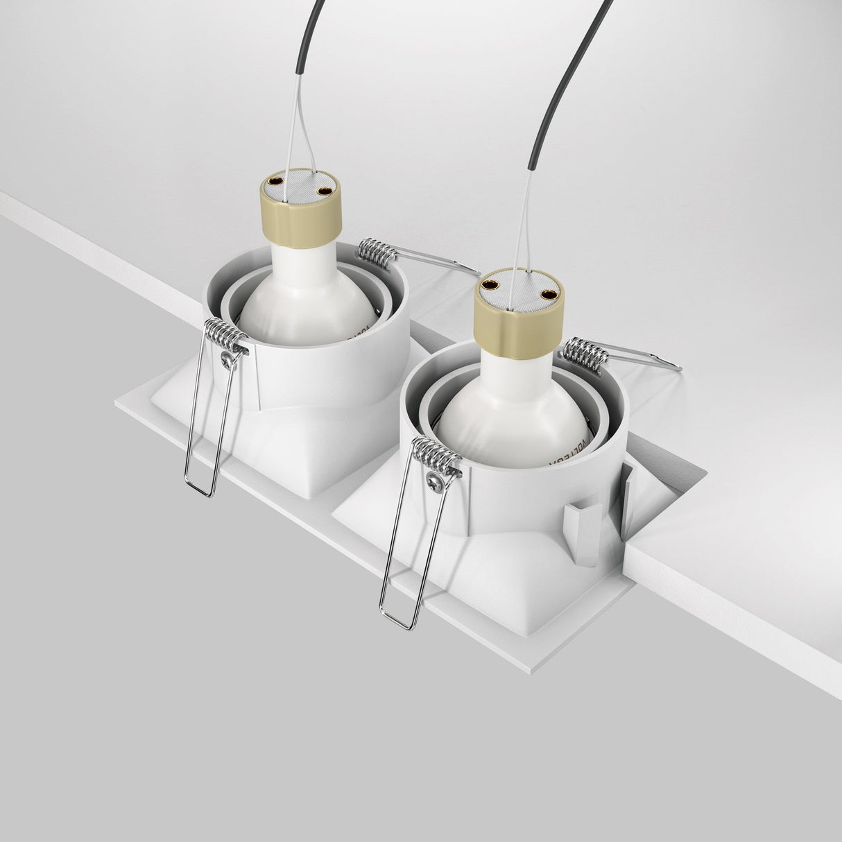 Two Dot Twin Tilt Rectangular Recessed Downlights in white, known for energy-efficient lighting, are positioned side by side on the ceiling. They are shown with exposed wires and metallic clips being installed.