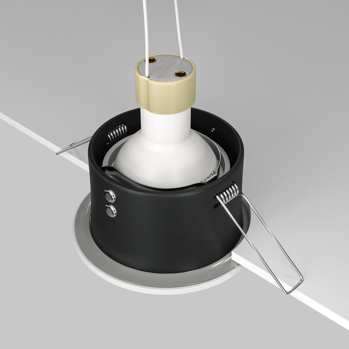 The Zoom Single Fixed Round Recessed Downlight - White features a white bulb set in its black casing, secured by metal spring clips and enhanced with a white trim against a grey background.