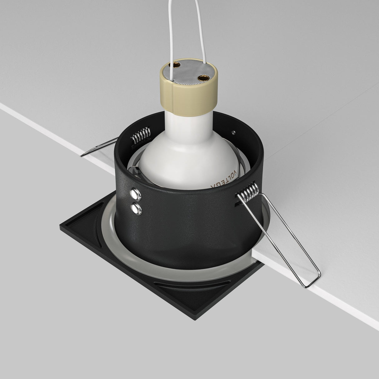 A close-up of the Zoom Single Fixed Square Recessed Downlight - Black shows visible wiring. The fixture, rated IP65, includes clamps and a white bulb holder, partially installed in a ceiling cutout.