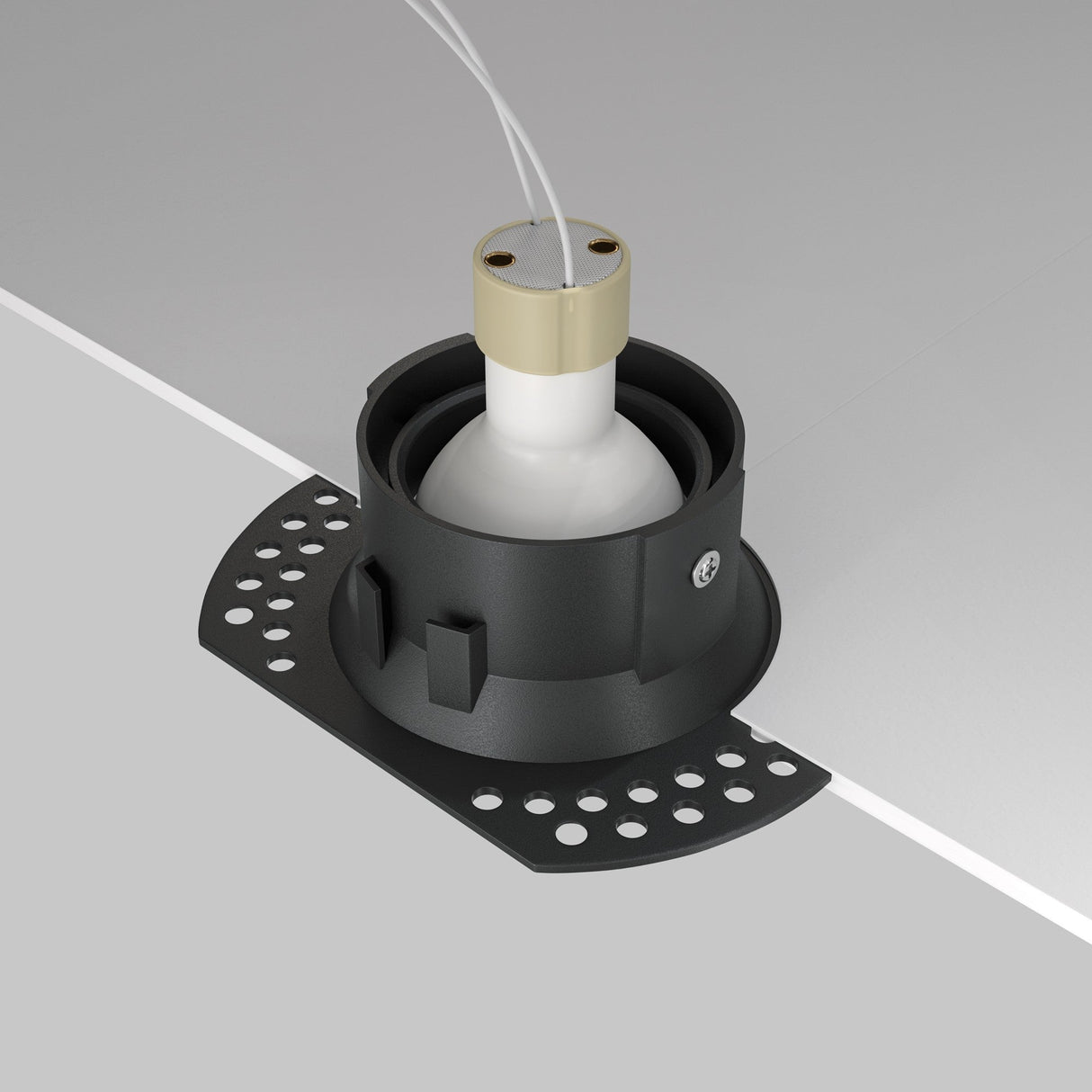 The Dot Single Tilt Round Plaster-in Recessed Downlight in black features a circular casing, adjustable tilt for optimal illumination, white interior bulb holder, and wires. Its perforated sides ensure secure mounting on flat surfaces.