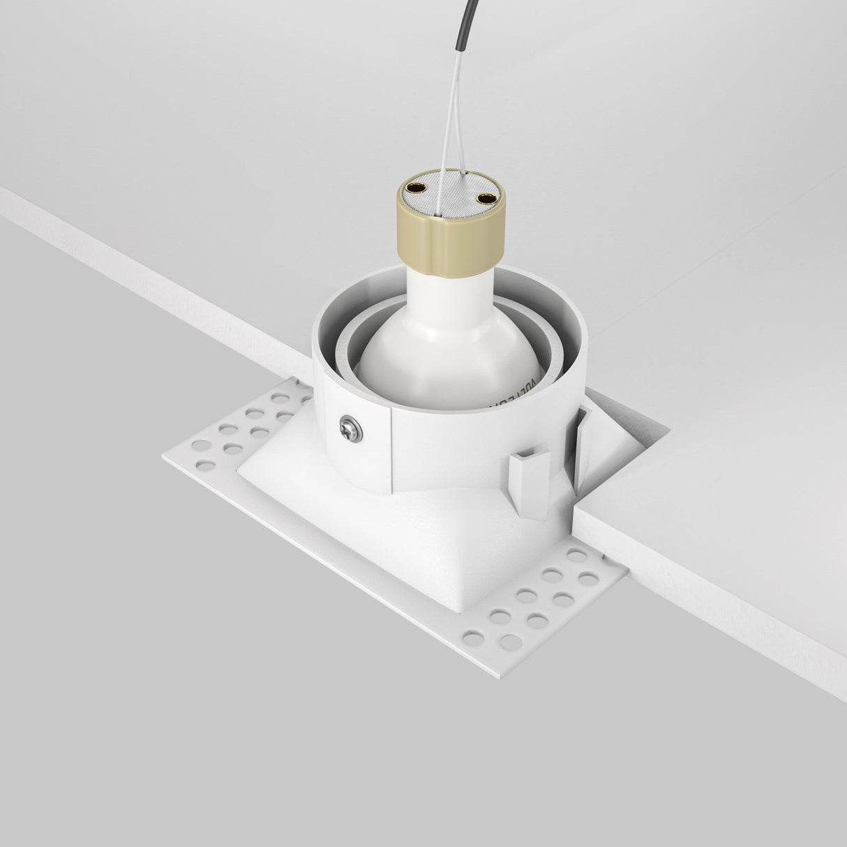 Close-up of the Dot Single Tilt Plaster-in Square Recessed Downlight in white with a gold accent, featuring an adjustable light direction. The downlight is integrated into a plaster-in setup with a visible wire attachment and part of the ceiling panel exposed.