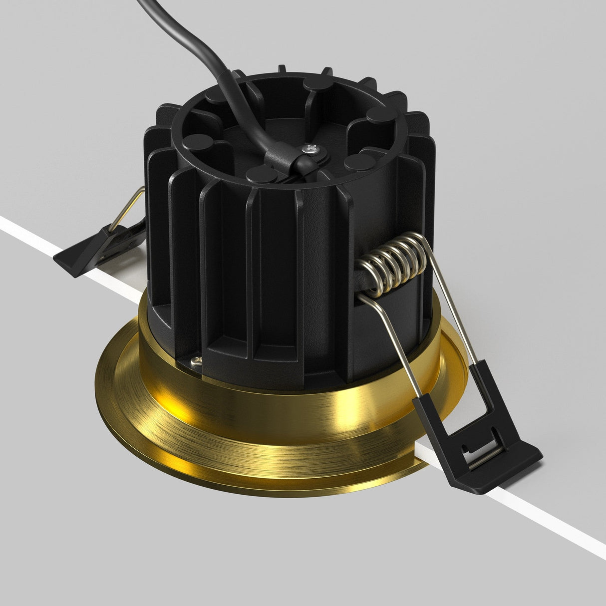 The Round LED Recessed Downlight 12W 3000K - Brass showcases a black cylindrical housing with brass trim, features installation-friendly spring clips, and has a wire coming from the top, displayed on a white surface.