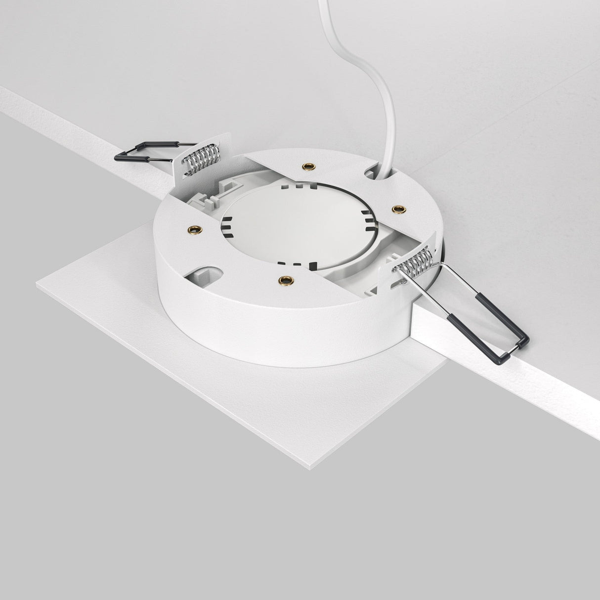 Close-up of a white Hoop Single Fixed Square Recessed Downlight being installed in a ceiling, highlighting its modern design. The square fixture is open, showing the LED light source and metal spring clips for securing it, with a power cable extending from the top.