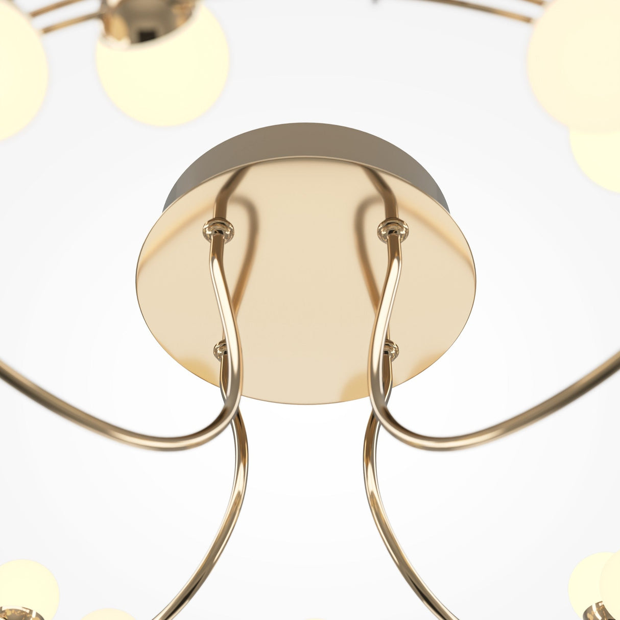 A close-up of the Tessara LED Semi-Flush Light 3000K 55W - Gold reveals its sleek ceiling mount. The fixtures gold finish and outward-curving arms each support an energy-efficient bulb, exuding modern elegance with its minimalist design against a plain white background.
