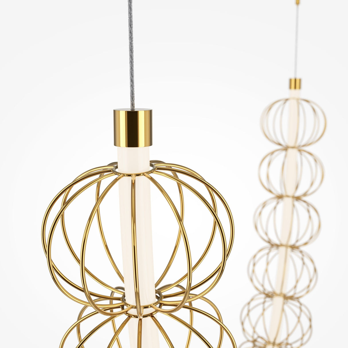 Two Golden Cage LED Cord Wire Surface-Mount Suspension Lights in gold hang from the ceiling, featuring a geometric and spherical wireframe design that resembles a minimalist golden cage against a clean white background.