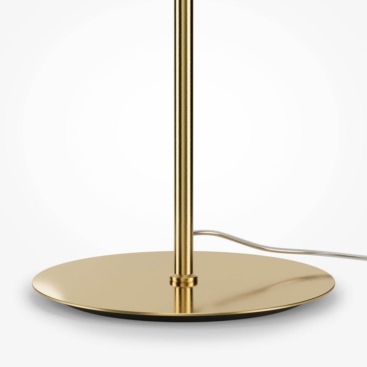 Close-up of the Pattern LED Floor Lamp - Gold with its energy-efficient features and sleek gold finish. The circular base and extending cord are set against a soft, pale background, highlighting the lamps minimalist contemporary elegance.