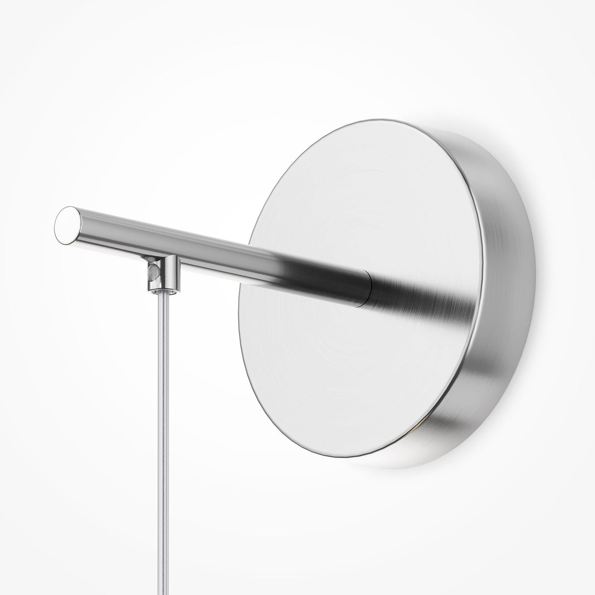 The Pattern LED Wall Light - Chrome features a modern, minimalist design with a round brushed metal base and a horizontal cylindrical arm in chrome, complemented by a vertical power cord—ideal for sleek, contemporary spaces.