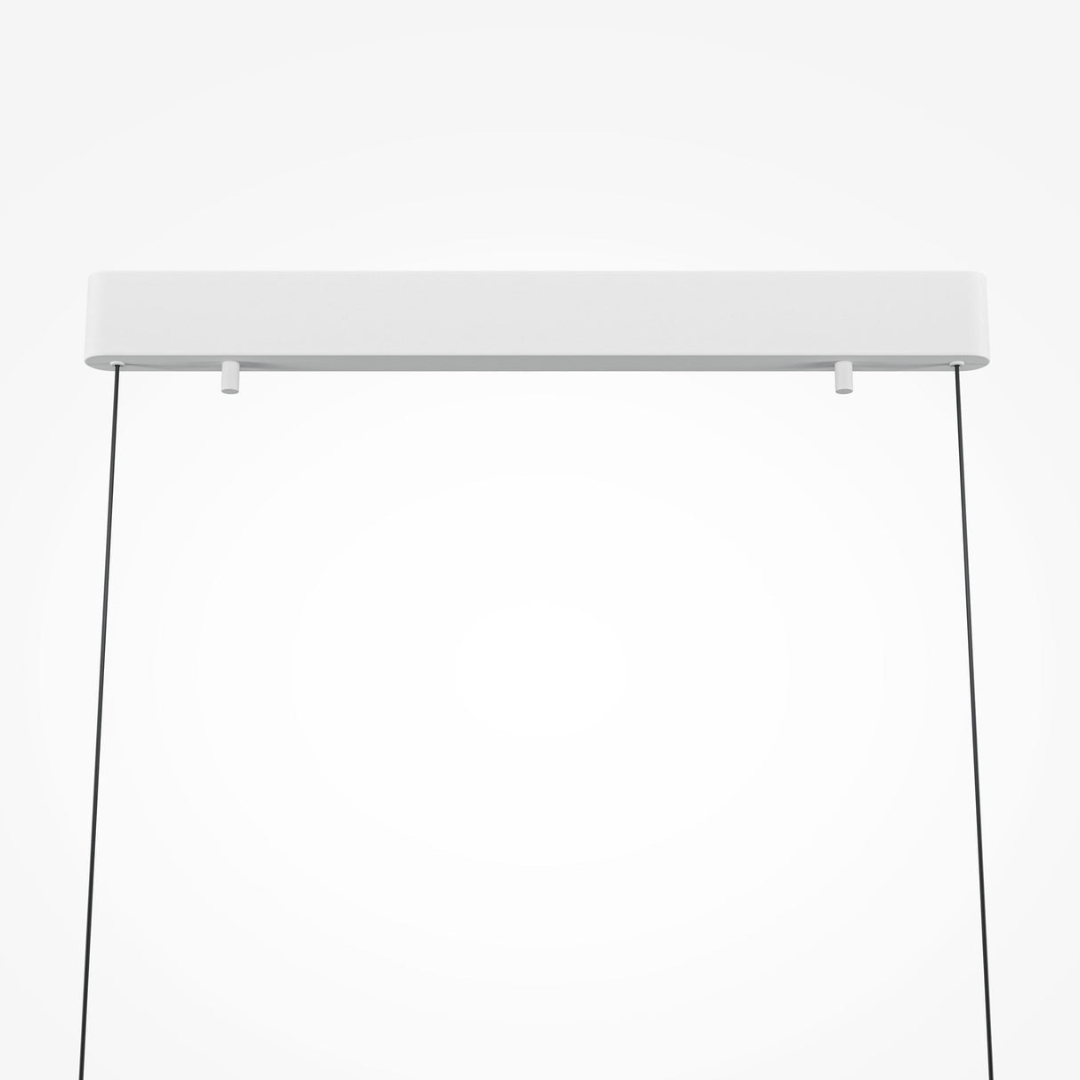 The Motion LED Dimmable Linear Suspension Light - White features a sleek rectangular fixture, suspended by black wires. This minimalist design combines elegance with advanced LED technology for a sophisticated modern look.