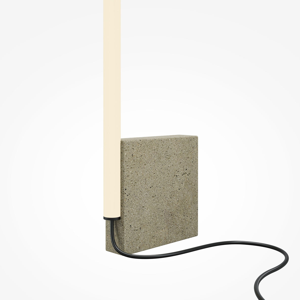 The Solid LED Floor Lamp 3000K 24W - Grey boasts a minimalist design with a vertical cylindrical light on a textured stone base and a black cord that elegantly complements its modern aesthetic.