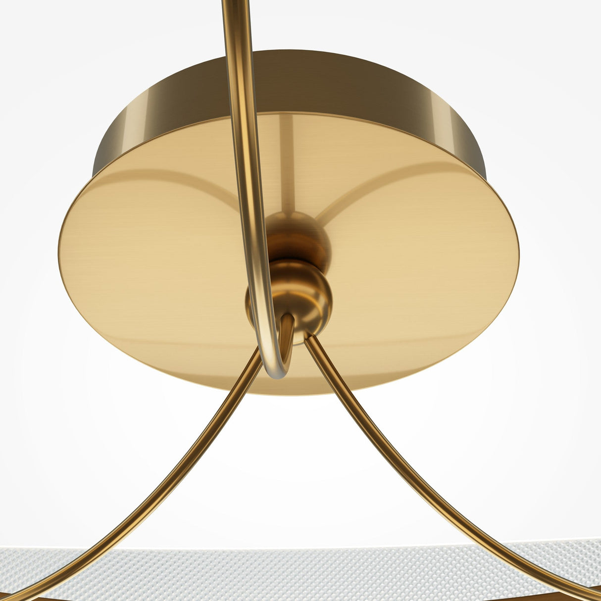 A close-up of the Breeze LED Ceiling Light showcases its modern brass design, featuring a circular base and curved arms. The sleek frame and LED technology create a contemporary look against a plain white background.