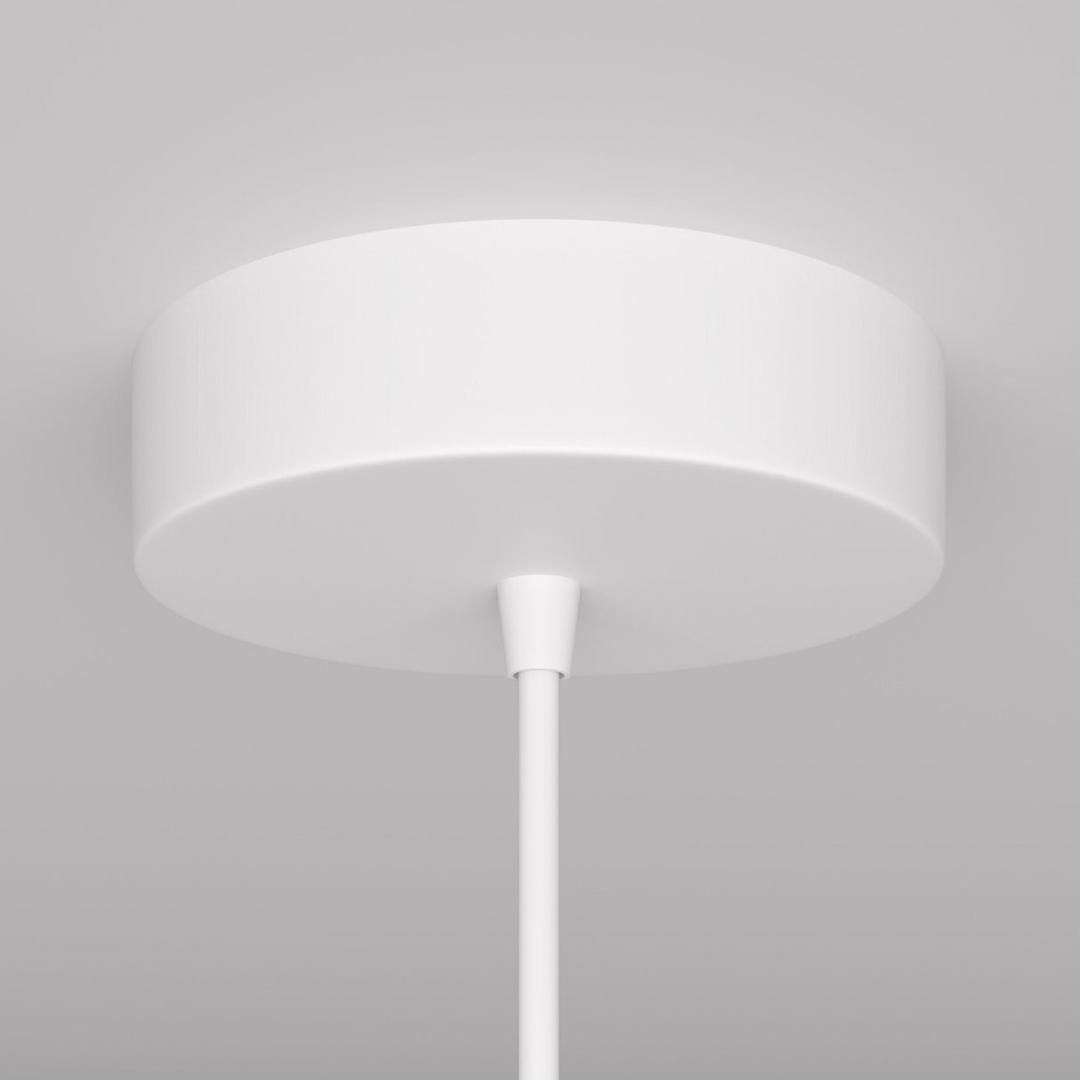 The white Arrow 1 Light Long Cone Pendant is a minimalist, circular ceiling light fixture with an arrow-like central rod, mounted flush against the ceiling for a subtle modern aesthetic in contemporary interiors.