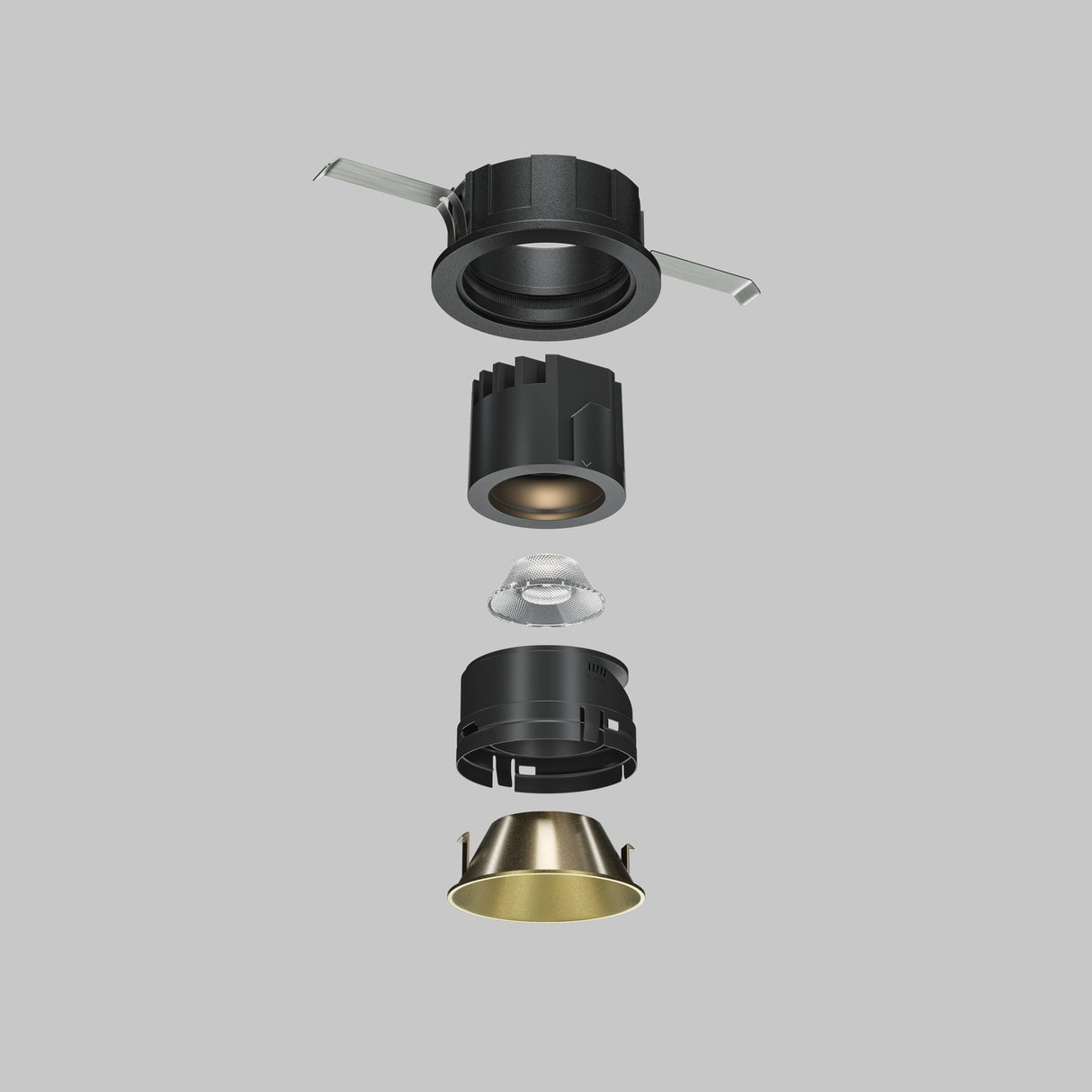 An exploded view of recessed lighting features on a gray backdrop, showing components sequentially: the mounting bracket, black cylindrical housing, LED component, internal casing, and a Wise Decorative Reflector Frame 49mm in matte gold.