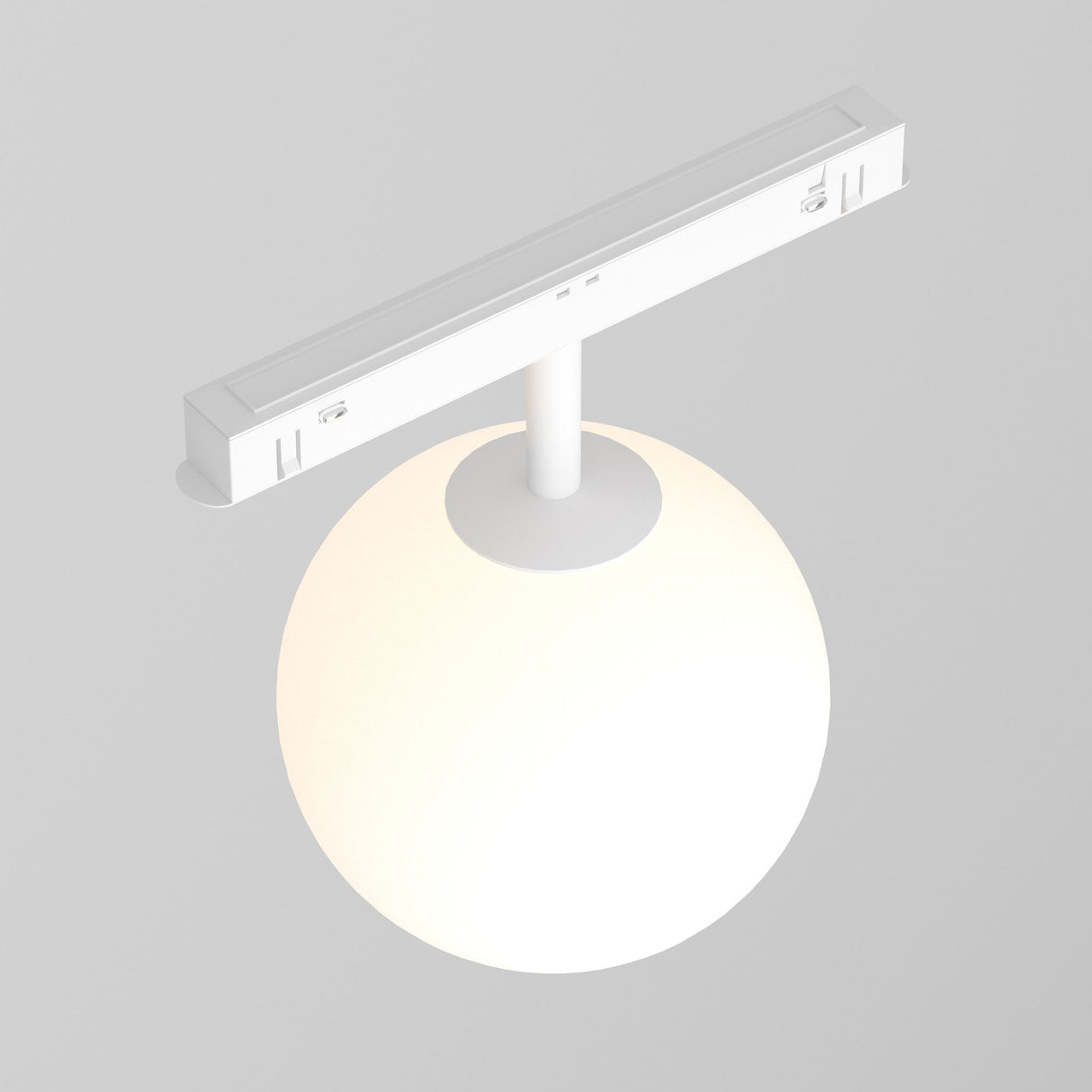 The Luna LED Magnetic Exility Track Globe Ceiling Light features a minimalist design with a white spherical frosted glass bulb on a horizontal bar, offering modern lighting. It emits a soft 3000K warm white glow that blends seamlessly with light gray backgrounds.