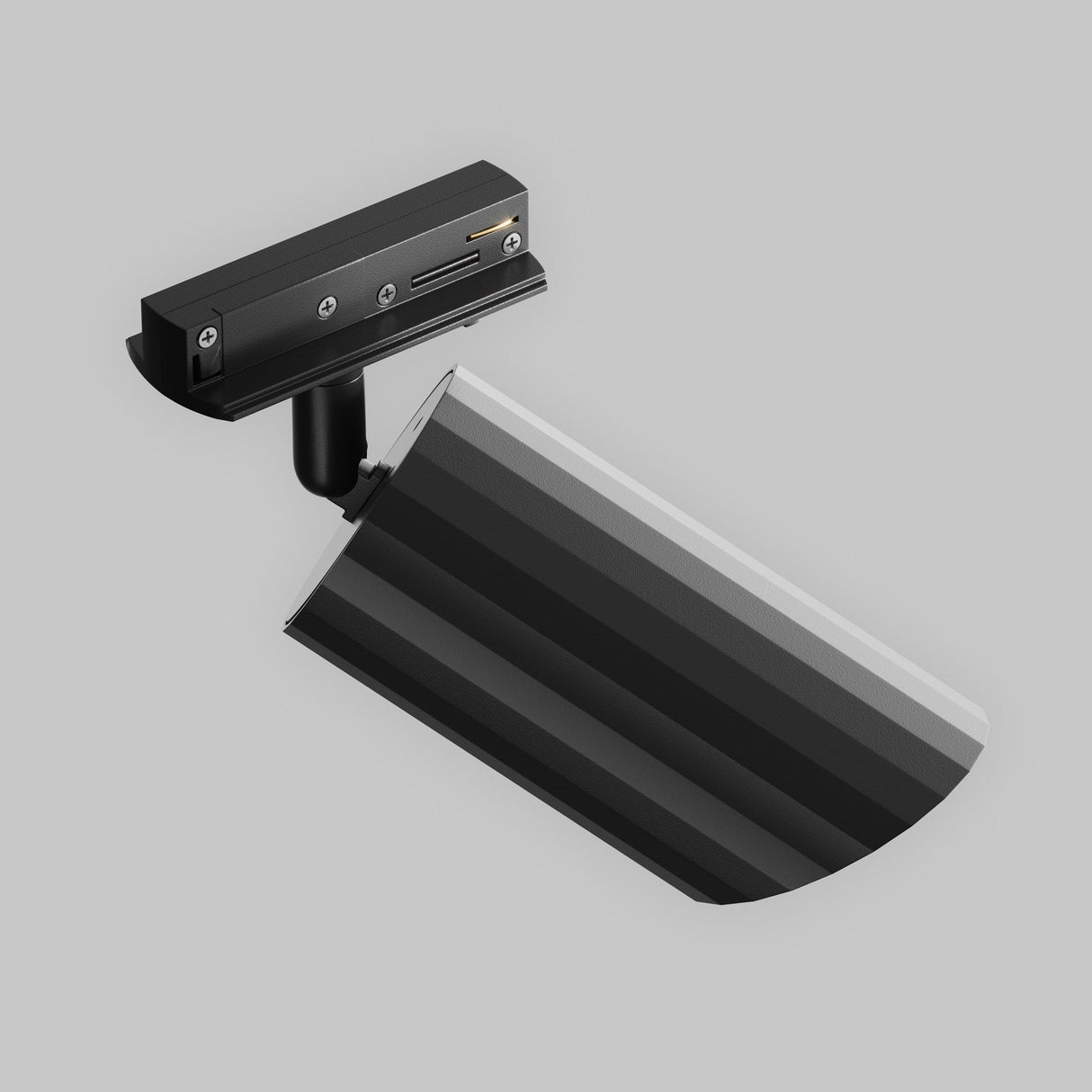 The Lipari Single Phase Unity Track Spotlight is elegantly installed on a gray wall, featuring a modern black base and arm. Its adjustable head presents striped gray tones, seamlessly merging minimalist design with functionality for refined modern lighting.