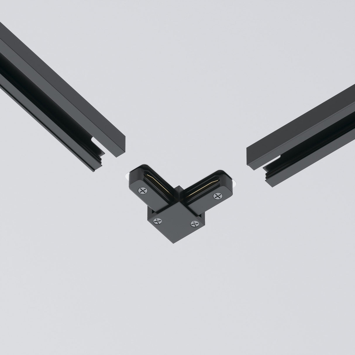 Two sections of the Unity Single Phase Surface-Mounted Track in dark metal are joined by a black L-connector, with visible screws, against a light gray background.