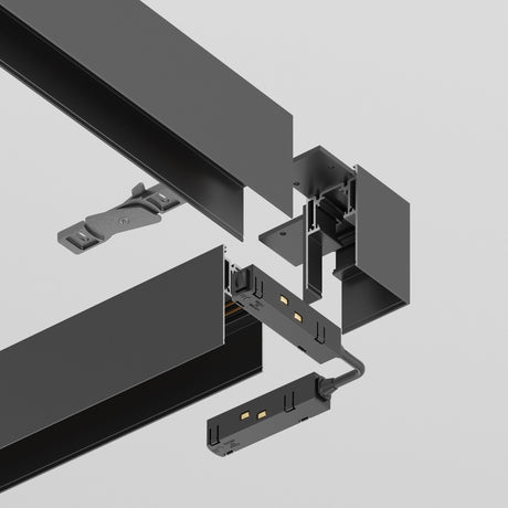 An exploded view shows a black S35 Magnetic Surface-Mounted Track Corner Connector with various parts like connectors and mounts aligned and separated for assembly illustration against a light gray background.