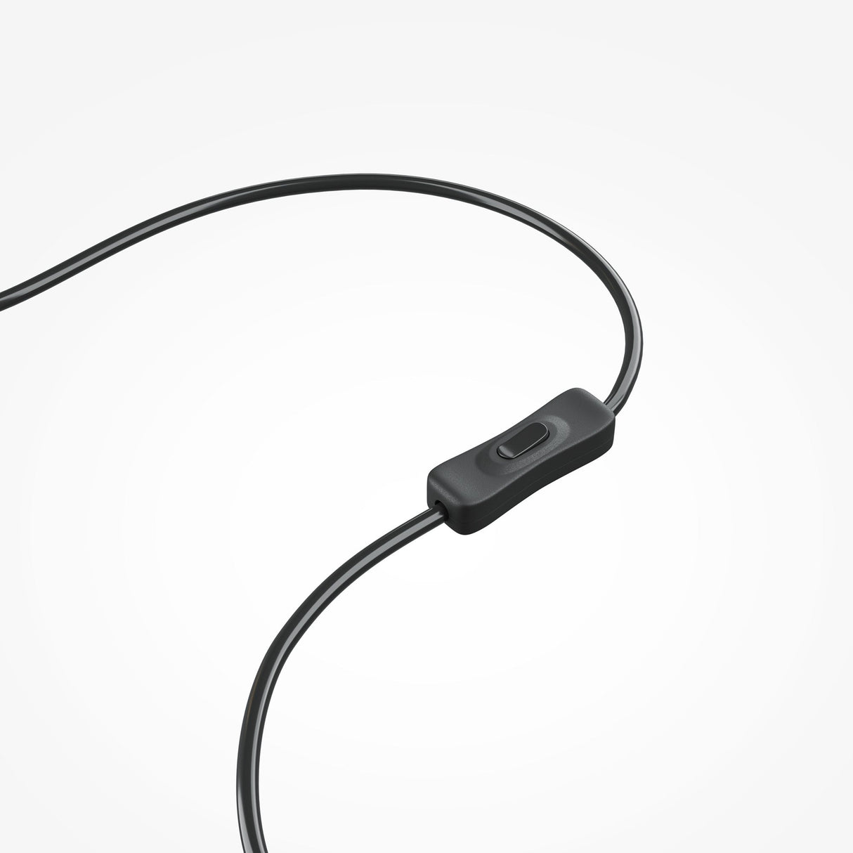 Close-up view of a black headphone cable with an inline remote having a single brass button, all set against a plain white backdrop. Product: Plons LED Table Lamp - Brass.