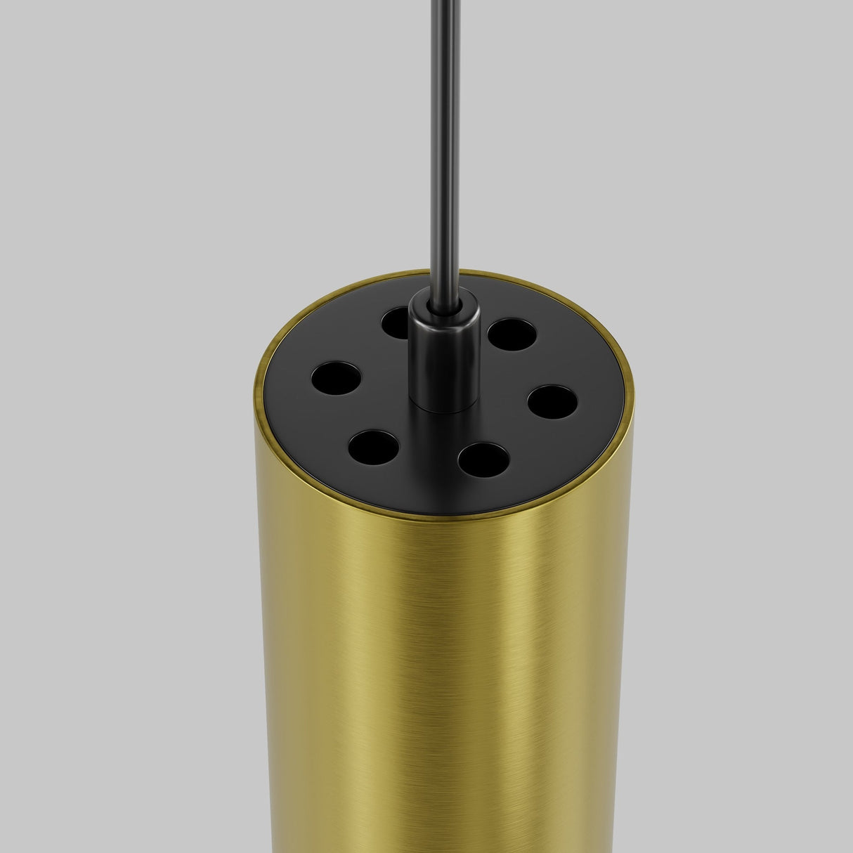 The Focus LED CCT Smart Dimmable Exility Magnetic Track Pendant Light in black and brass is a cylindrical design with multiple top holes, a vertically extending black wire, and set against a plain gray background. It is 12W and adjustable between 2700-6000K.
