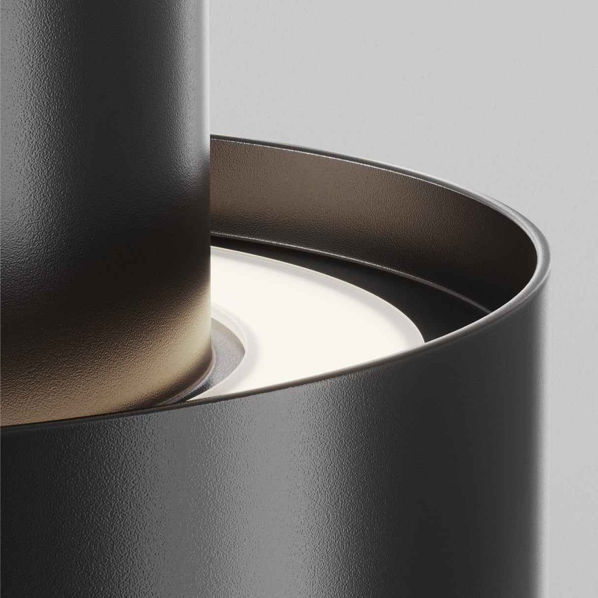 Element detail of Planet LED Medium Round Surface Downlight in Black, showing its sleek, minimalistic design.